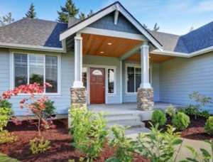 House with front porch and finished landscaping design