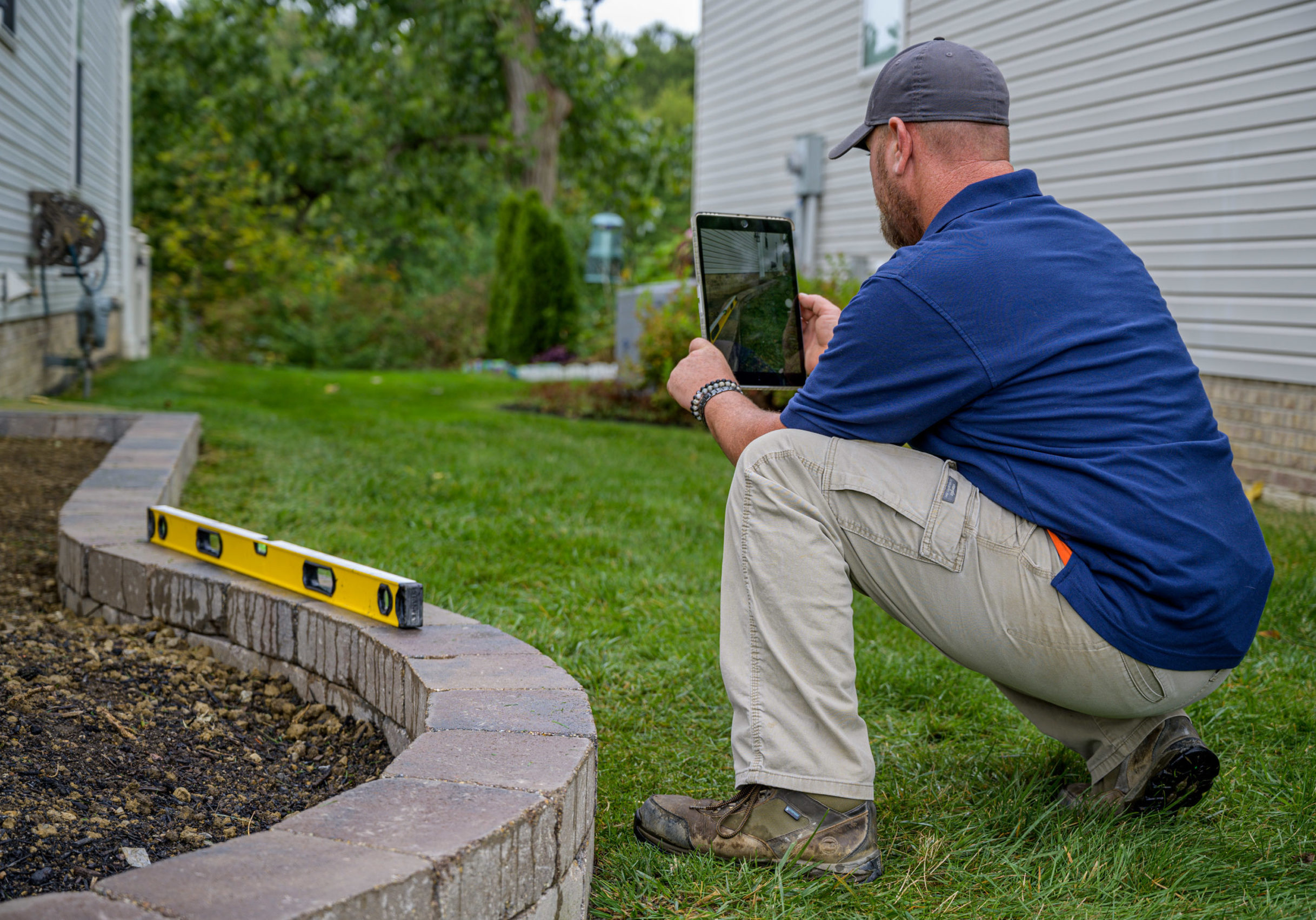 using latest technology to share progress with homeowner on new landscape installation