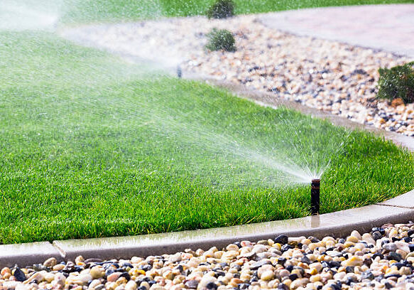 Automatic sprinklers watering lawn